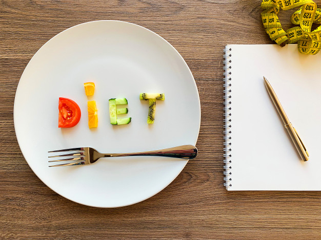 word-diet-made-sliced-vegetables-white-plate-diet-plan-wood-background_118454-3092.jpg